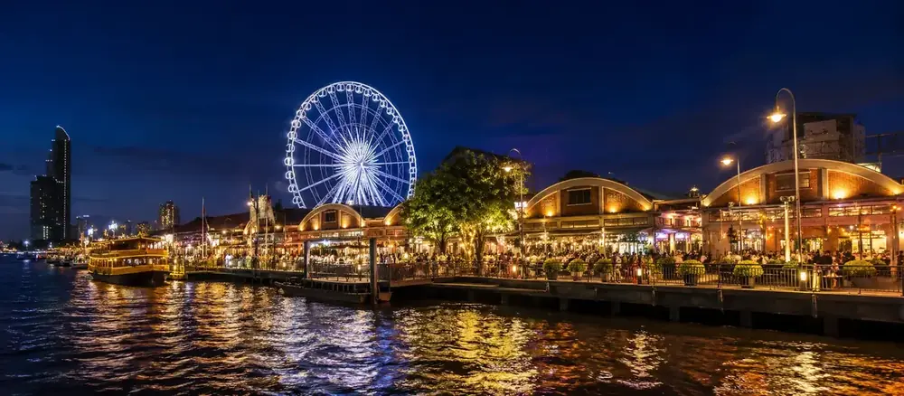 Asiatique The Riverfront lit up at night on the Chao Phraya river in Bangkok